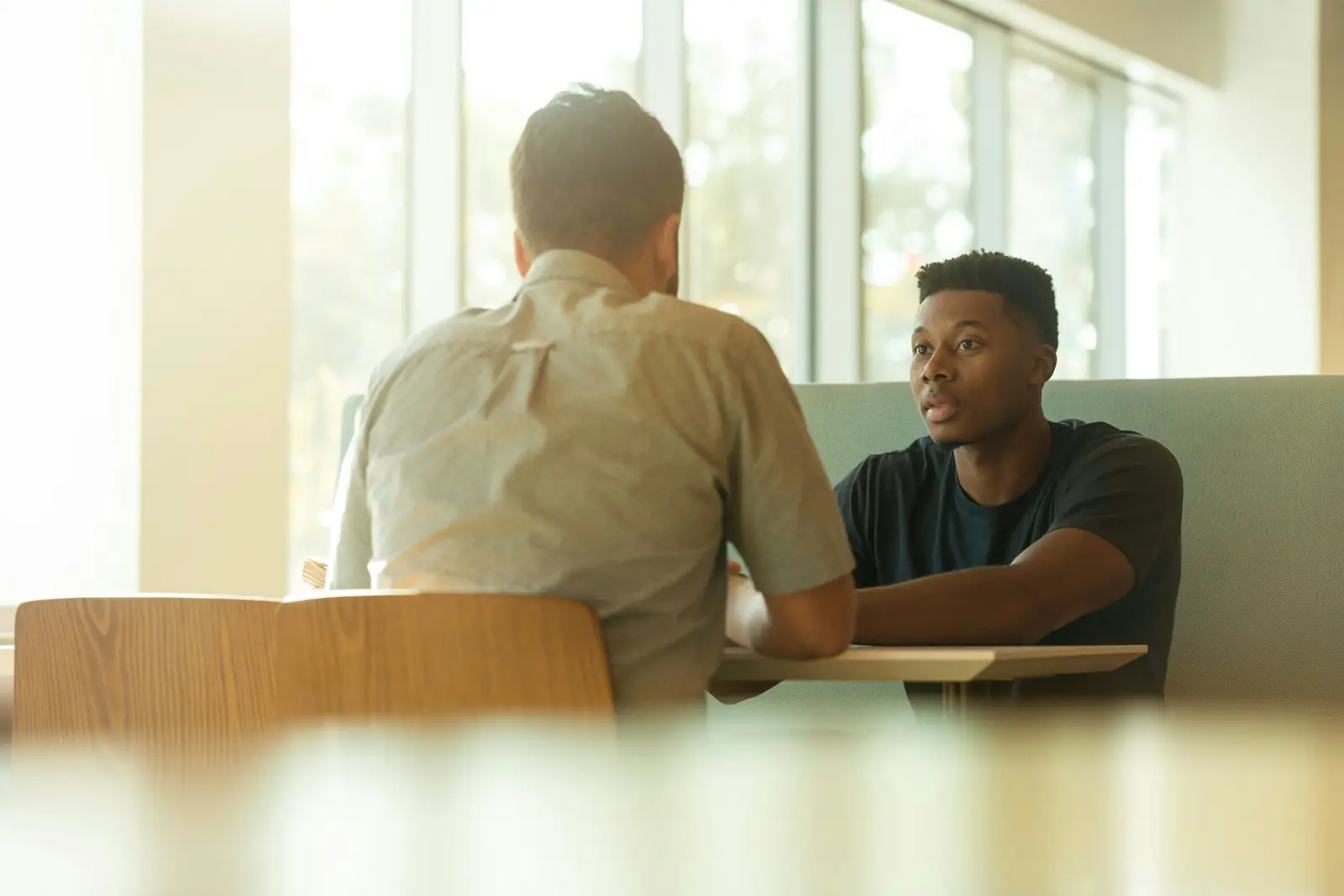 A counselor meeting one-on-one with a student